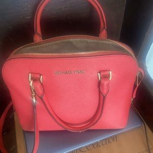 Awesome Michael Kors bag. Minimum use. Bag is PEACH COLORED. REASONABLE OFFERS